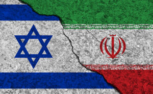Cracked,Painted,Concrete,Walls,Between,The,Israel,Flag,And,Iran.
