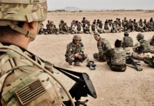 American soldiers overseeing training of their Afghan counterparts at Camp Bastion in Helmand Province,  Afghanistan, March 22, 2016. (Adam Ferguson/The New York Times)
